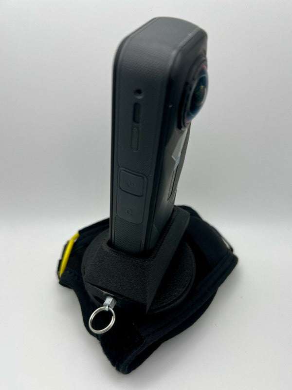 Insta360 X5 tandem handcam glove with optional cutaway.