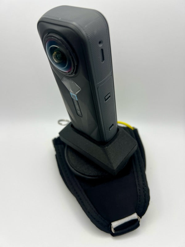 Insta360 X5 tandem handcam glove with optional cutaway.