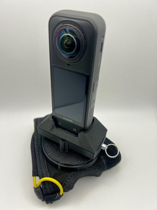 Insta360 X5 tandem handcam glove with optional cutaway.
