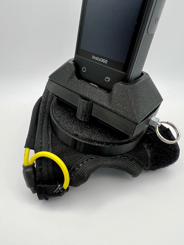 Insta360 X5 tandem handcam glove with optional cutaway.