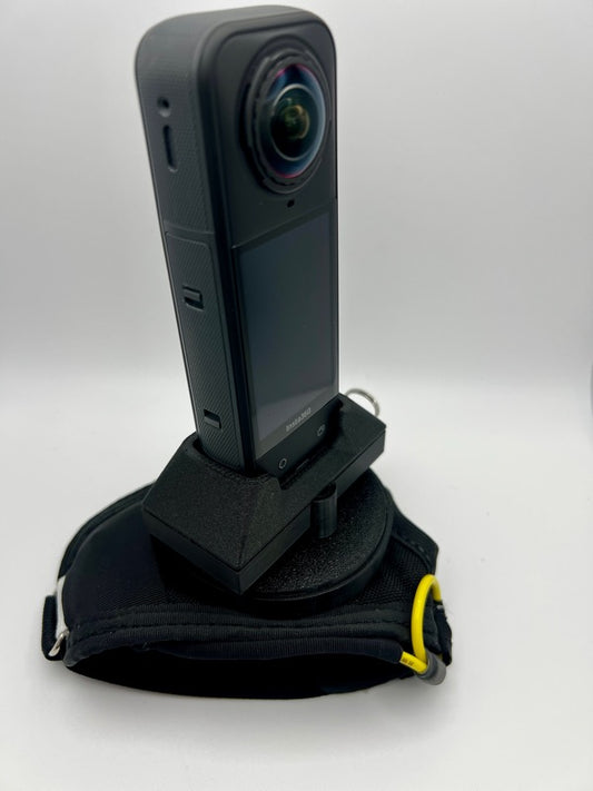 Insta360 X5 tandem handcam glove with optional cutaway.